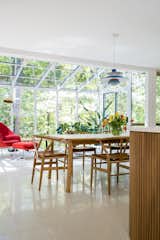 Dining Room, Pendant Lighting, Terrazzo Floor, and Chair The sunroom. Photo by Sarah Shields  Photo 2 of 7 in Bloomington Flansburgh House by Susan Yeley