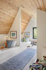 cozy bunk room loft area with reading lights by koncept