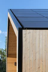 closer view of rake parapet creating a flush solar panel aesthetic
