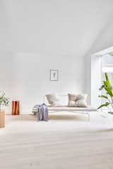 Living Room, Lamps, Floor Lighting, Coffee Tables, and Light Hardwood Floor Daybed by C/RO Copenhagen, Aiayu pillow, Hübsch plaid, Lumière Bricoleur lamp.  Photo 6 of 15 in Furniture by Sheiba
