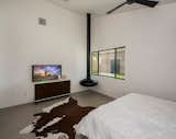 A touch of character in the Master Suite with a floating fire orb and concrete flooring