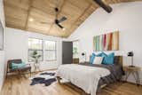 Master Suite with hardwood flooring and a soaring wood panel, vaulted ceiling 