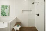 Open shower area with curb-less IPE floors and sitting bench