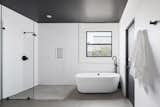 Modern Master Bath with freestanding soaking tub and oversized walk-in shower