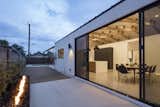 A steel fire pit just off the kitchen dining area with industrial strength slider doors