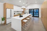 Modern kitchen touches such as white appliances.
