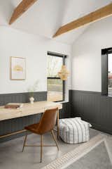 Home office / home school area / work station with black shiplap details, soaring ceilings and exposed wood beams. 
