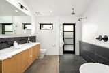 Maser bathroom with floating vanity, soaking tub and oversized walk-in shower. 