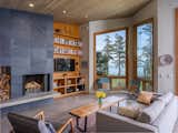 Living Room, Recessed Lighting, Bookcase, Storage, Coffee Tables, Chair, Sofa, Bamboo Floor, and Wood Burning Fireplace  Photo 4 of 19 in Modern San Juan Islands Retreat by Glassenstump Creations