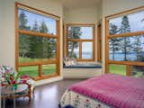 Awake every morning to slanting morning sun and walls of views from the main house bedroom. Window seat provides the perfect perch for watching the sun rise or even winter storms roll by.