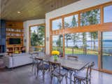 Dining Room, Table, Recessed Lighting, Bamboo Floor, Pendant Lighting, Wood Burning Fireplace, Storage, Shelves, and Chair Spacious rooms throughout, this living space has been designed with entertainment in mind.   Photo 1 of 19 in Modern San Juan Islands Retreat by Glassenstump Creations