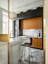 Kitchen designed by Blockstudio. Ceiling lamp, Lee Broom.