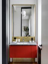 Wall lamp, Parachilna. Mirror and vanity unit designed by Blockstudio.

