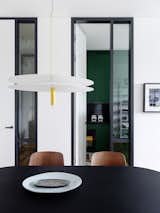 Chairs, Fredericia. Table, Menu. Ceiling lamp, Vibia. 