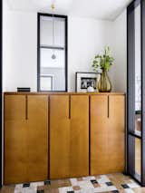 Cupboard designed by Blockstudio. Hanging lamp, Michael Anastassiades. Portable lamp, Menu.