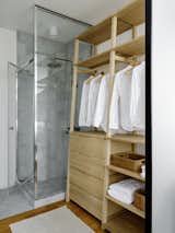 Wardrobe designed by Blockstudio. Walls and floor, Bianco Carrara marble.