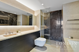 Bath Room, Marble Counter, Marble Floor, Drop In Sink, Open Shower, Marble Wall, Recessed Lighting, One Piece Toilet, and Soaking Tub  Photo 19 of 22 in The Tower: Luxurious London Living with Sweeping Views of the Thames by London Realty International