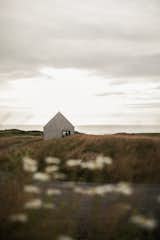The Halfway Hut tucked into the grassy dunes adjacent manicured greens
