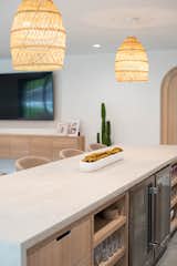 We wanted the look of concrete countertops, but did not want the seam in the long island. We selected a water-proof plaster material and had our contractor create these custom countertops.