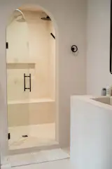 The entire bathroom is coated in a waterproof plaster. It's so soft to the touch and on foot, it feels like you're on vacation when you step inside.