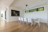Elegant dining area with clerestory view to the woods