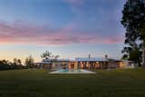 Bend N Creek Ranch captures the essence of Cliff May’s architecture. Similar to May’s landscaping,
a swimming pool is in full view, even from the main entry’s glass wall, directly opposite the front
door of the home.