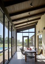 A screened porch, located next to the living and dining rooms, is used for outdoor entertaining.  Photo 2 of 7 in East Texas Ranch by FPC Architects & Planners