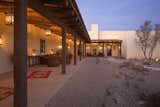 To keep the outdoors incorporated into the design the three guest rooms are only accessed from the open air corridor along the courtyard. Visitors must exit to the exterior of the lodge to reach to reach the other parts of the dwelling.