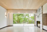 Frameless windows, warm white oak ceilings and polished, heated concrete floors combine to create a serene, calm, urban oasis.