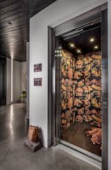The bold wallpaper in the elevator just around the corner from the front entrance
