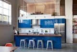 Kitchen, Colorful Cabinet, Dishwasher, Refrigerator, Ceramic Tile Floor, Range, Ceiling Lighting, and Wood Counter  Photo 4 of 13 in Bernice Place by Levy Art + Architecture