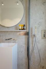 Bath Room, Pedestal Sink, Corner Shower, Open Shower, Stone Slab Wall, Full Shower, and Ceiling Lighting bathroom detail  Photo 12 of 25 in Coastal Home Grado by Architect & Friends