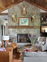 The Great Room

In the Great Room, a mix of patterns and textures surrounds a natural stone fireplace, creating a cozy and welcoming seating area.