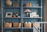 Kids Room, Toddler Age, Playroom Room Type, Bedroom Room Type, Storage, Bookcase, Neutral Gender, Shelves, Boy Gender, and Bed Bamboo style bookshelves allowed for ample storage space to display special toys and lots of books.  Photo 3 of 7 in Beach Charm Nursery by Sayler Studio