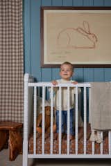 Kids Room, Playroom Room Type, Bed, Toddler Age, Neutral Gender, Bedroom Room Type, and Boy Gender It's hard to resist dressing Marty to match his nursery every day.   Photo 7 of 7 in Beach Charm Nursery by Sayler Studio