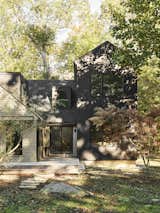 Exterior view of the house with the new "Connector" in the middle and two-story addition to the right.