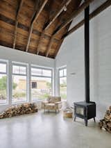 Nova Tayona Architects screened-in porch with wood stove
