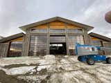 Commercial Amarr doors and windows courtesy of Garage Doors Plus, Wyoming. The central upper window on both East and West ends of the building roll open, allowing for cross ventilation and alleviates the need for air conditioners.