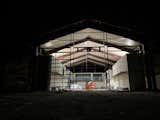 14 recycled shipping containers make up the central core and courtyard while only 300 watts of indirect and bounce LED lighting provides complete coverage and allows all fixtures to be hidden from view.