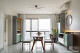 The Dining area- 
Either Night or day, its irresistible to get off the dining. 
The feeling of oneness in materials flowing from the veneer panel to the dining table, the colours that flow over the units, overall it connects the user. 
