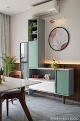 The Crockery unit- 
Designed to fit in clients love to display their earthenware which full filled by the open-close and see through surfaces. The veneer paneling behind gives a background for the unit and is adorned with a beautiful circular artwork. 