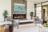 Living Room, End Tables, Concrete Floor, Gas Burning Fireplace, Chair, and Recessed Lighting  Photo 3 of 8 in Bringing The Outside In by Jeannette Mock