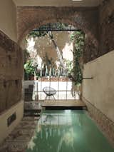 Our pool sits below 16th century original archway