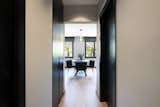 Hallway and Medium Hardwood Floor  Photo 12 of 27 in An elegant flat where dark tones predominate by Sincro