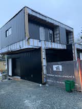 Exterior, House Building Type, Metal Siding Material, Wood Siding Material, and Flat RoofLine Lane/North Elevation: Two Level (with basement) Coach House under construction.  Completion date spring 2023.  Photo 3 of 4 in The Taylor Coach House