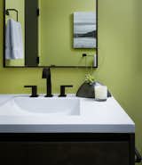 Detail shot of guest bath with one piece concrete vanity top with an integrated sink. 