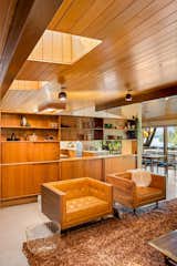Living Room, Terrazzo Floor, Bookcase, Ceiling Lighting, and Chair Built-in Teak Buffet  Photo 7 of 51 in The Wallmark House by Moritz Kundig by Alice M Galeotti WA RE Lic 21106