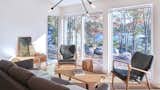 Living Room, Chair, Light Hardwood Floor, Pendant Lighting, and Sofa  Photo 9 of 13 in Seabright Residence by Peter Braithwaite Studio