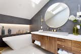 Skylights are used in the master bathroom to add ample light without sacrificing privacy