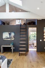 The family room mezzanine adds an architectural element and a fun play area to the space